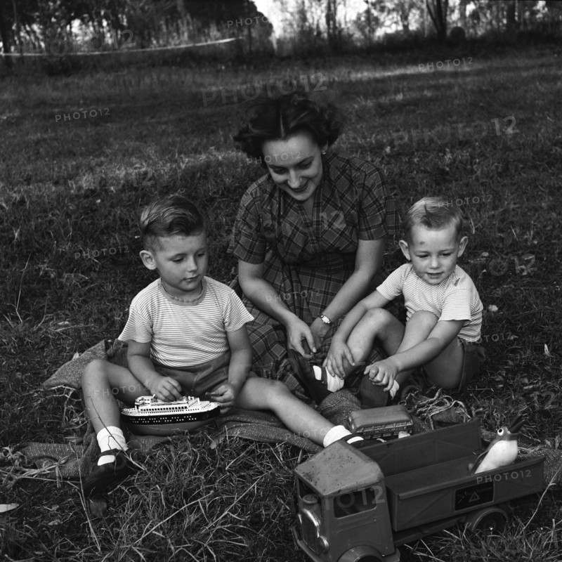 Cecily and children. Cecily Gaueghan playing with her two sons. The boys are playing with some toys. North Kinangop, Kenya, 9-12 February 1953., Central (Kenya), Kenya, Eastern Africa, Africa.
