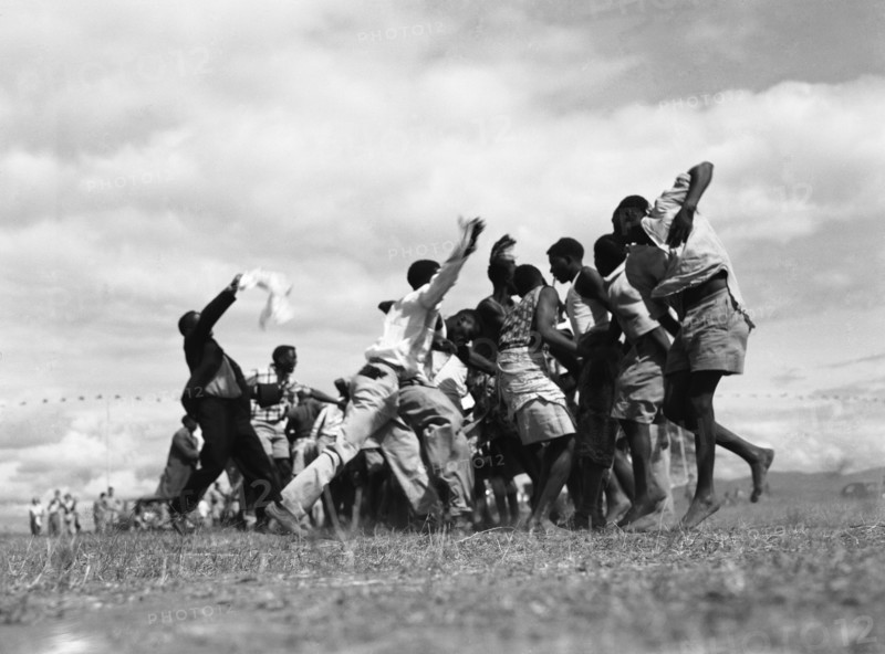 Wakamba dancing. A group of men from the east Kenyan Wakamba tribe dance at a 'ngoma', a word meaning drum that is also used to describe traditional celebrations. Kajiado, Kenya, 2 June 1953. Kajiado, Rift Valley, Kenya, Eastern Africa, Africa.