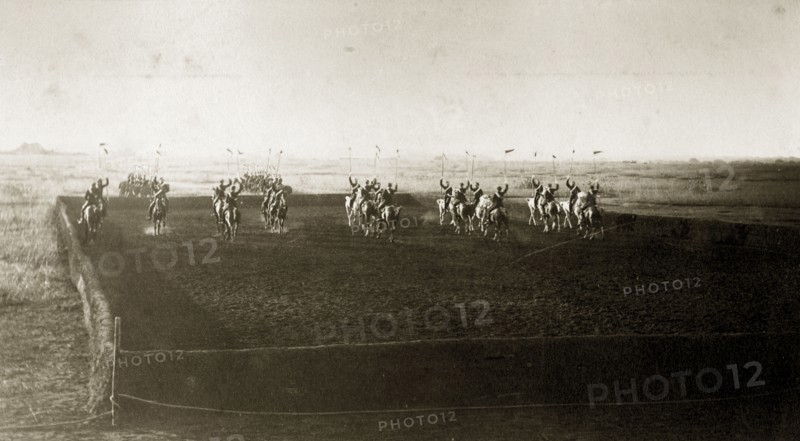 Cavalry practice ground. British men from an Indian Army cavalry unit cross each other in an arena as they practice riding with their standards raised. India, circa 1880. India, Southern Asia, Asia.