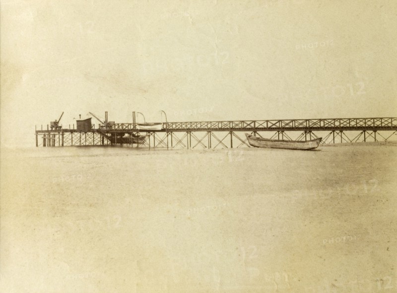 Calicut pier, India. The historic pier at Calicut stretches out into the Arabian Sea on the Kerala coast. Calicut, India, circa 1910. Calicut, Kerala, India, Southern Asia, Asia.