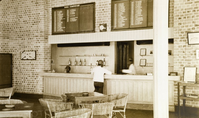 Rangoon Golf Club bar. The bar at the newly opened club house of the Rangoon Golf Club, facing out onto a veranda. Boards above the bar list winners of the Burma Championship and Captains of the club since 1909 when it first opened. Rangoon (Yangon), Burma (Myanmar), circa 1952. Yangon, Yangon, Burma (Myanmar), South East Asia, Asia.