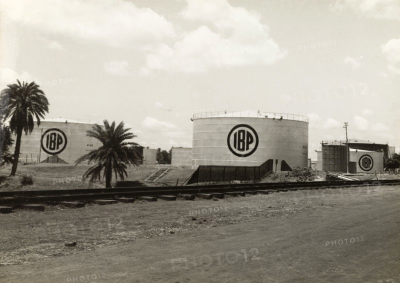 Indo-Burma Petroleum Company plant. Exterior shot of several large petrol storage tanks at the Indo-Burma Petroleum Company plant. Burma (Myanmar), circa 1942. Burma (Myanmar), South East Asia, Asia.