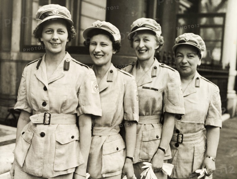 A British Red Cross team bound for Kenya. Four women in the British Red Cross line up for a group portrait on their last day in London before flying out to Kenya via Egypt. London, England, April 1954. London, London, City of, England (United Kingdom), Western Europe, Europe .