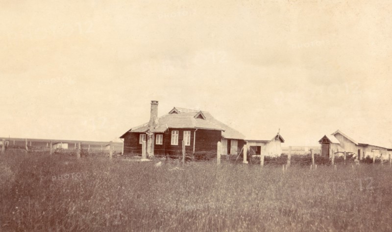 Charles Bungey's house. This timber-framed house was built for Charles Bungey, a training officer with the Kenyan Public Works Department, by the apprentices of his department in March 1922. The apprentices' quarters can be seen in the right background. Nakuru, Kenya, 1922. Nakuru, Rift Valley, Kenya, Eastern Africa, Africa.