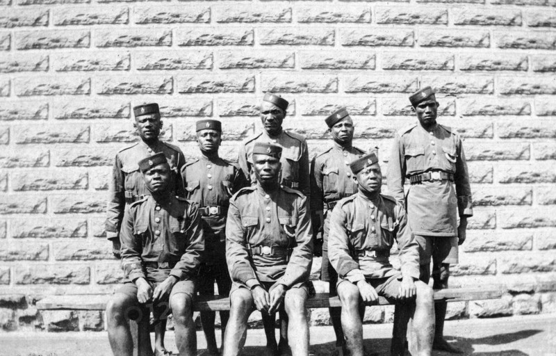 Warders at Nairobi Jail. Group portrait of eight African jail warders wearing uniform. Nairobi, British East Africa (Kenya), 1917. Nairobi, Nairobi Area, Kenya, Eastern Africa, Africa.