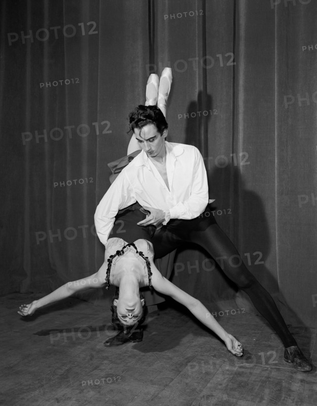 Nicholas Polajenko and Daphne Dale. Dancer Nicholas Polajenko lifts Daphne Dale during a ballet routine. Both dancers wear traditional ballet costumes. Kenya, 28 October 1955. Kenya, Eastern Africa, Africa.