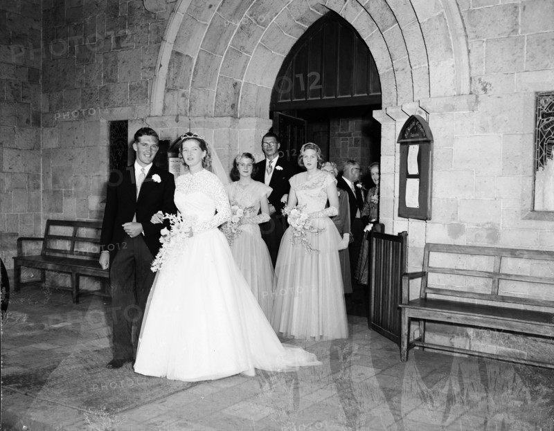 June Watkin's wedding. A wedding party leaves the church, the procession headed by bride June Watkin and her newlywed husband. Kenya, 5 November 1955. Kenya, Eastern Africa, Africa.