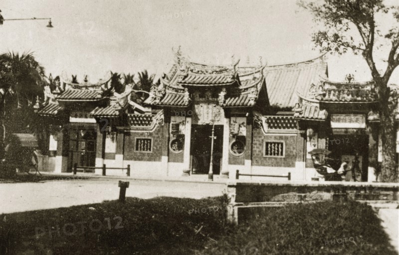 Kuan Yin See temple. Roadside view of Kuan Yin See, a Chinese temple of the Goddess of Mercy located on Burmah Road. The temple has a pagoda-style roof and decorative fretwork windows. Georgetown, British Malaya (Malaysia), 4-8 February 1924. Georgetown, Penang, Malaysia, South East Asia, Asia.