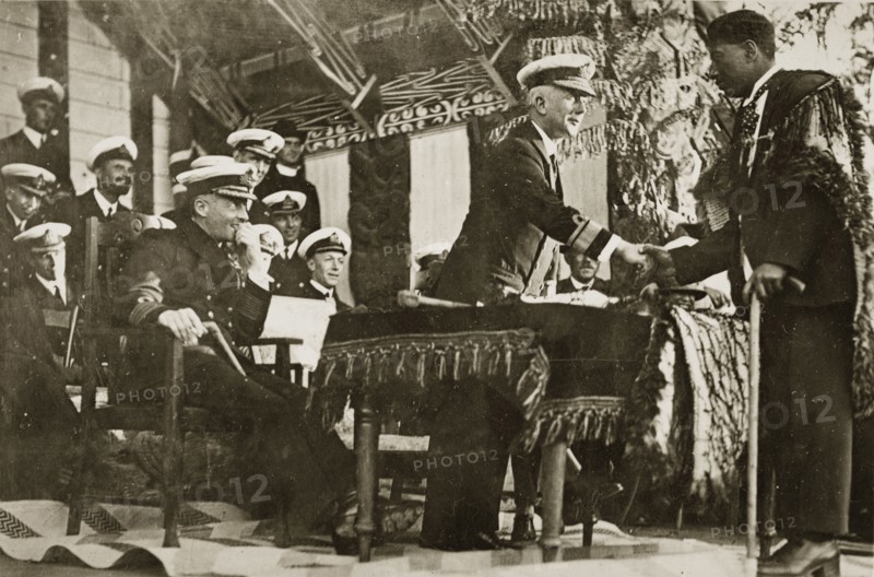 Rear Admiral Brand shakes hands. Rear Admiral Sir Hubert Brand shakes hands with a Maori man identified as 'Mr Harris' at a presentation ceremony. Probably Rotorua, New Zealand, 10-17 May 1924. Rotorua, Bay of Plenty, New Zealand, New Zealand, Oceania.
