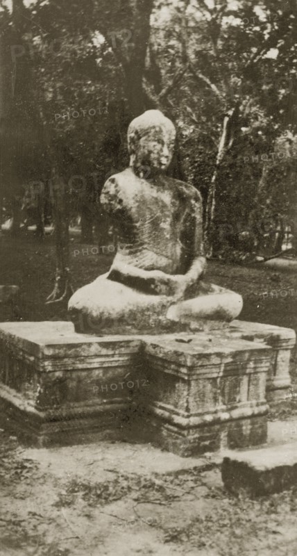 Buddah statue. A statue of a Buddha belonging, according to the original caption, to a lost city. Ceylon (Sri Lanka), 27-31 January 1924. Sri Lanka, Southern Asia, Asia.