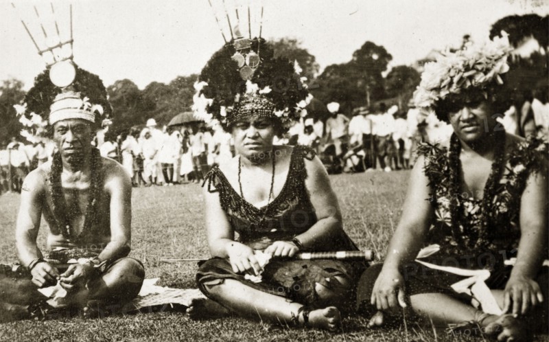 Samoans at a 'meke' dance. Samoan men in traditional costume at a 'meke' in Albert Park. They wear elaborate headdresses made from flowers and their necks are adorned with garlands of flowers (leis). Suva, Fiji, 21-27 May 1924. Suva, Viti Levu, Fiji, Pacific Ocean, Oceania.