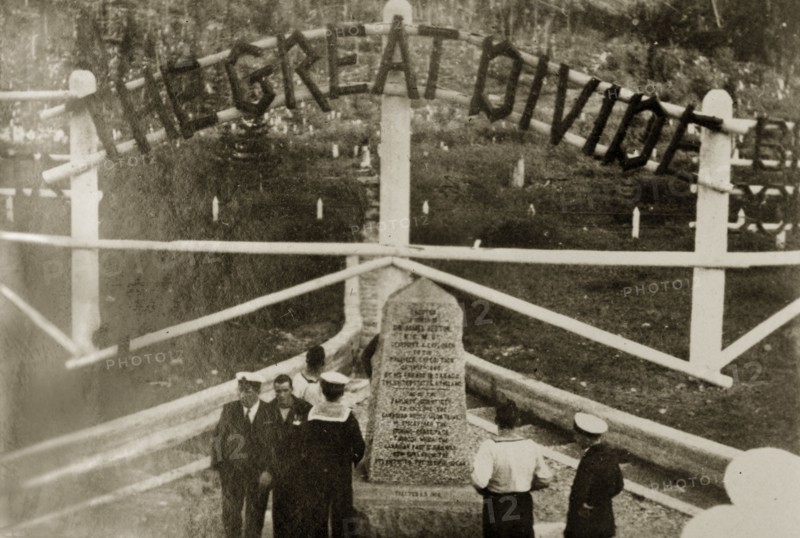 The Great Divide'. Uniformed naval personnel stand beside a stone marker indicating the division between the provinces of Alberta and British Colombia. Canada, 21 June-4 July 1924. Canada, North America, North America .