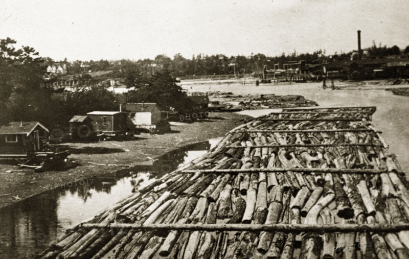 Canadian boomlogging. Logs contained by booms float on a Canadian river. British Colombia, Canada, 21 June-4 July 1924., British Columbia, Canada, North America, North America .