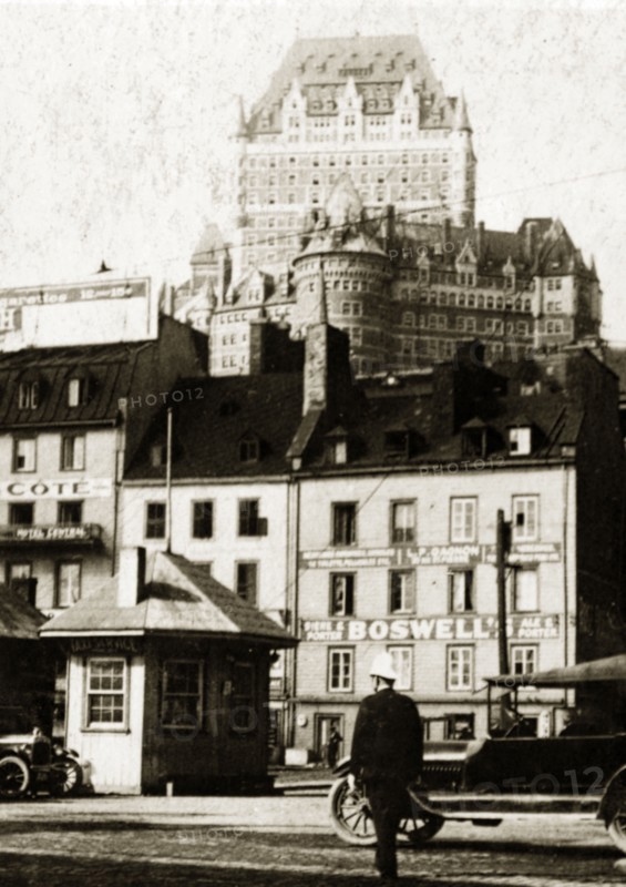 Old town, Quebec. View of shopfronts in the old town with the Chateau Frontenac Hotel visible in the distance. Quebec, Canada, 18 August-2 September 1924. Quebec, Quebec, Canada, North America, North America .