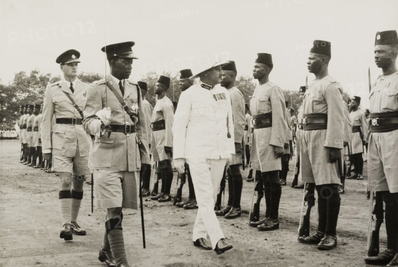 Inspection of the King's African Rifles. A European military officer, possibly a colonial Governor, inspects a regiment of the King's African Rifles. Probably Central Africa, circa 1955., Central Africa, Africa.