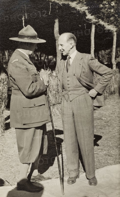 Sir Rennie meets General Shea. Sir Gilbert McCall Rennie (right), the Governor of Northern Rhodesia, meets with General Sir John Stuart MacKenzie Shea at an annual boy scout jamboree. Nkana-Kitwe, Northern Rhodesia (Zambia), 1952. Nkana-Kitwe, Copperbelt, Zambia, Southern Africa, Africa.
