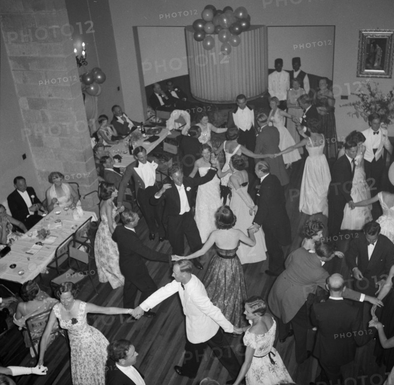 Dancing the 'Eightsome Reel'. European party guests fill the dancefloor to dance the 'Eightsome Reel' at the Limuru hunt ball. Limuru, Kenya, 27 October 1956. Limuru, Central (Kenya), Kenya, Eastern Africa, Africa.