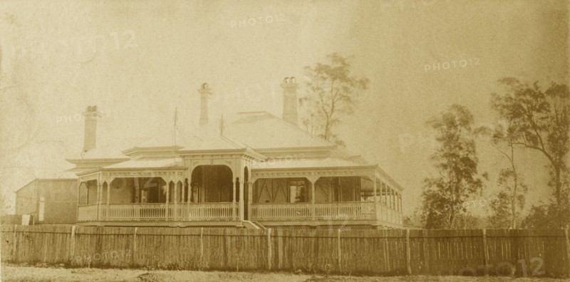 House called 'Nundora', Toowoomba. The Brodribb family's house 'Nundora', surrounded by a white picket fence. The house is colonial in style with a veranda running around three of its sides and a gabled roof supported by pillars. Toowoomba, Australia, circa 1890. Toowoomba, Queensland, Australia, Australia, Oceania.