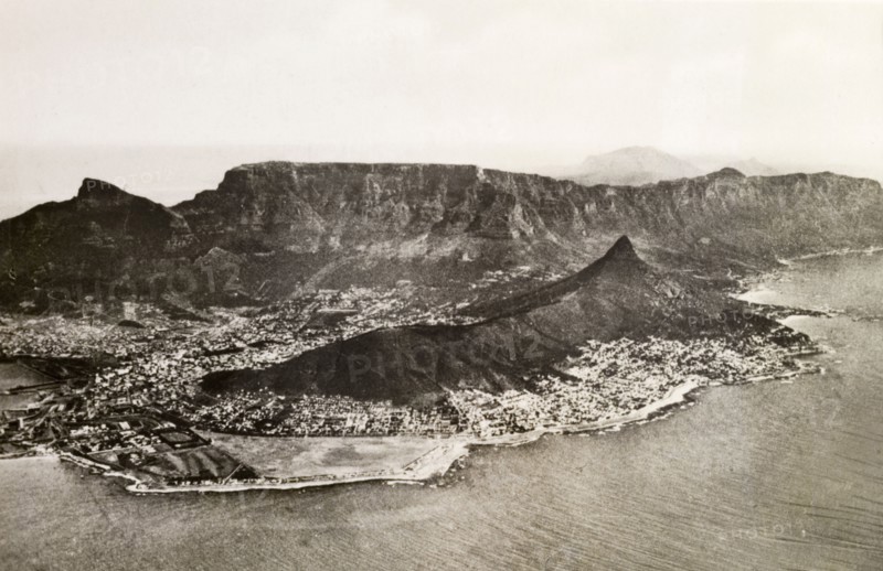 Cape Peninsula from the air. Aerial view of the Cape Peninsula showing the city of Cape Town nestled at the foot of mountains near the coast. Cape Town, Cape Province (West Cape), South Africa, circa 1936. Cape Town, West Cape, South Africa, Southern Africa, Africa.