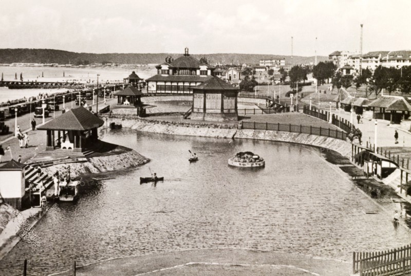 Children's outdoor pool, Durban. Two children paddle canoes on an outdoor boating pool near the seafront in Durban. Durban, Natal (KwaZulu Natal), South Africa, circa 1936. Durban, KwaZulu Natal, South Africa, Southern Africa, Africa.