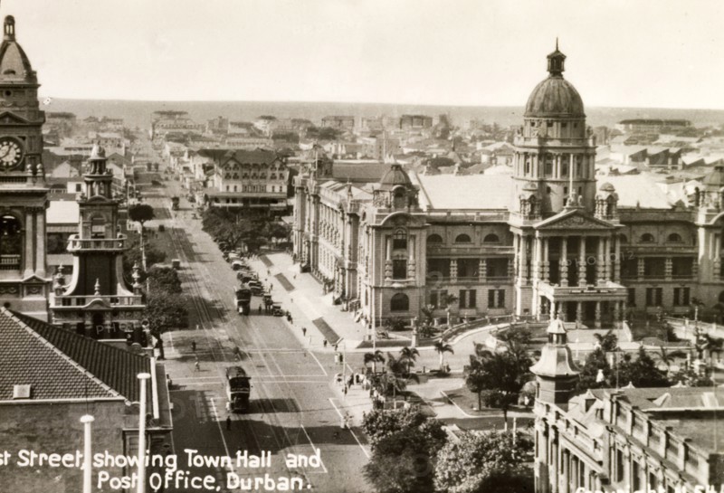 West Street, Durban. View along West Street towards the seafront, showing Durban's grandiose Town Hall building on the right. The clock tower belonging to the General Post Office building is also visible. Durban, Natal (KwaZulu Natal), South Africa, circa 1936. Durban, KwaZulu Natal, South Africa, Southern Africa, Africa.