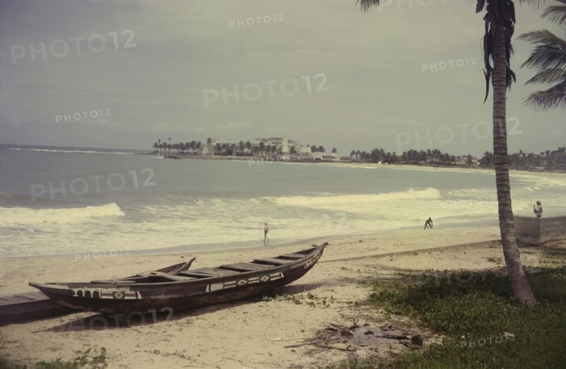 View towards Elmina Castle. View from a beach towards Elmina Castle across the bay. Elmina, Ghana, circa 1965. Elmina, Central (Ghana), Ghana, Western Africa, Africa.