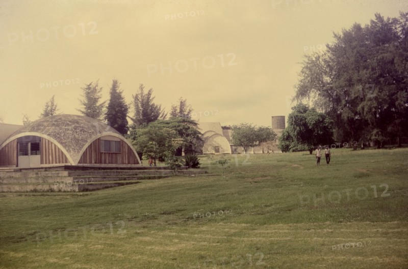 Muslim praying ground, Nigeria. A large open space in the university grounds provides a praying area for Muslim students and staff. The domed building to the left is a mosque. Nigeria, circa 1972. Nigeria, Western Africa, Africa.