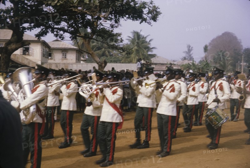 Fajuyi's state funeral. A uniformed military band perform in front of crowds at the state funeral of Lieutenant Colonel Francis Adekunle Fajuyi. Ado Ekiti, Nigeria, 1966. Ado Ekiti, Ekiti, Nigeria, Western Africa, Africa.