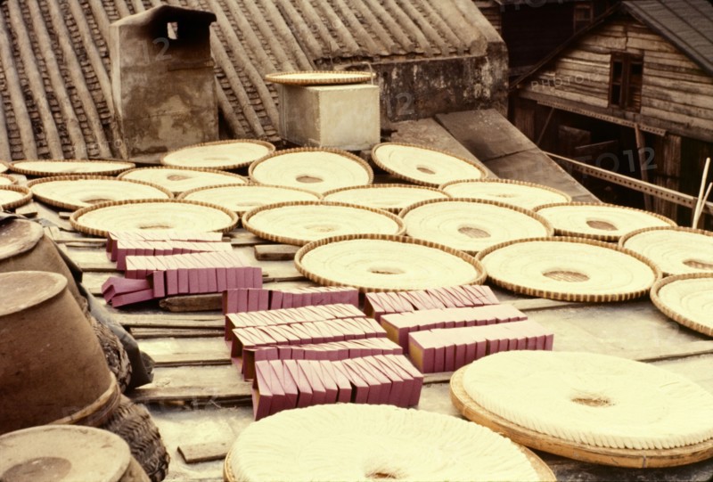 Noodles drying in the sun. Rings of noodles laid out to dry in the sun in flat baskets on a rooftop. Aberdeen, Hong Kong, People's Republic of China, January 1961. Aberdeen, Hong Kong, China, People's Republic of, Eastern Asia, Asia.