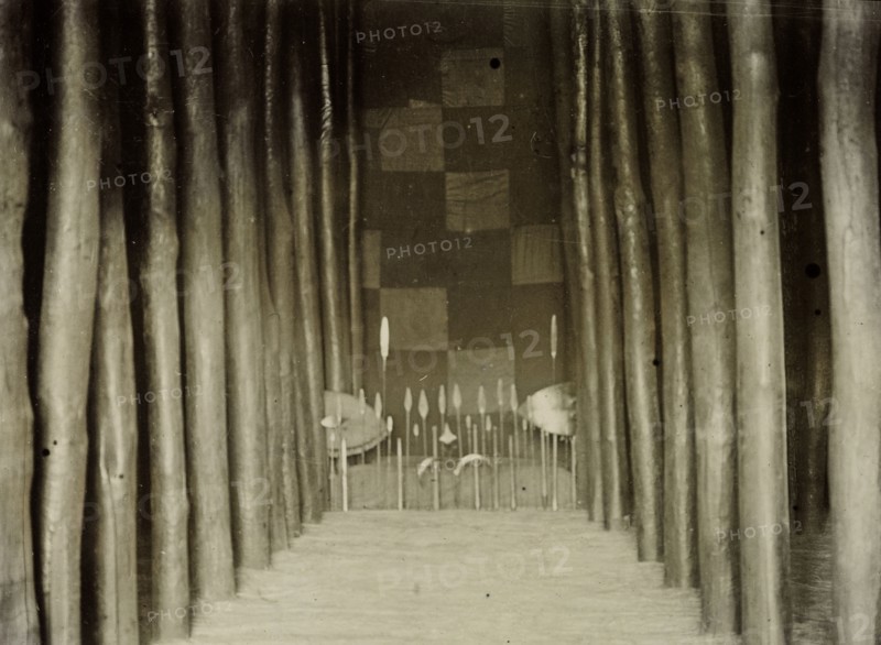 Interior view of tomb of Mutesa I. Interior view of the tomb of Mukaabya (c.1837-1884) decorated with a line of spears. Better known by his royal title of Mutesa I, he was Kabaka (King) of Buganda from 1856 until his death in 1884. Near Kampala, Uganda, 1906., Central (Uganda), Uganda, Eastern Africa, Africa.