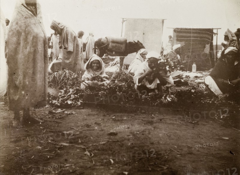 Market scene, Casablanca. Street traders crouch on the ground, trying to sell fruit and vegetables at a local market. Casablanca, Morocco, 1898. Casablanca, Casablanca, Morocco, Northern Africa, Africa.