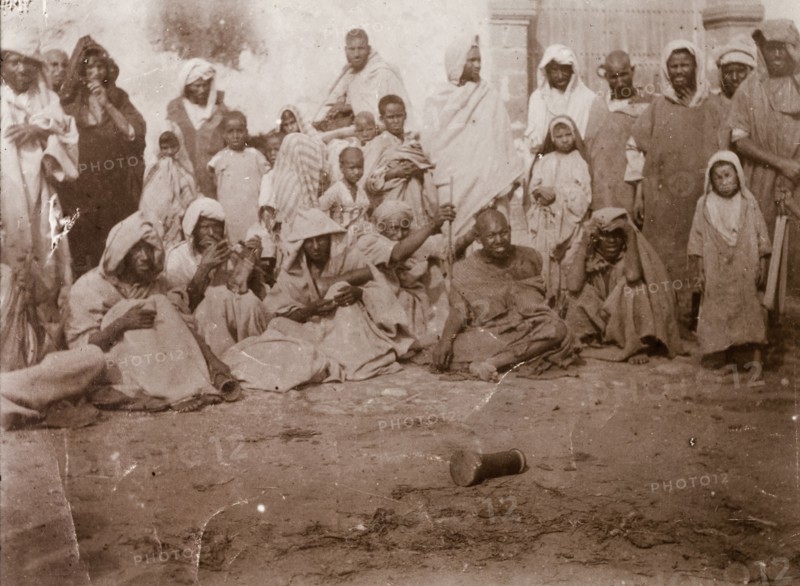 Storytelling at Safi. A 'halca' (audience) of Moroccan locals watches intently as a 'halaiqui' (storyteller) recites his traditional tales. Safi, Morocco, 1898. Safi, Safi, Morocco, Northern Africa, Africa.