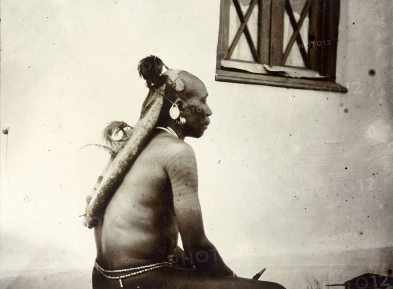 Turkana man's hairstyle. Profile shot showing the hairstyle of a Turkana man, daubed in traditional Turkana style using blueish clay. British East Africa (Kenya), 1906. Kenya, Eastern Africa, Africa.
