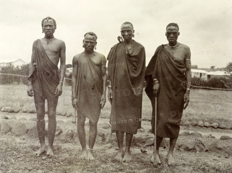 Four Kikuyu men. Group portrait of four Kikuyu men wearing traditional dress and jewellery. British East Africa (Kenya), 1906. Kenya, Eastern Africa, Africa.