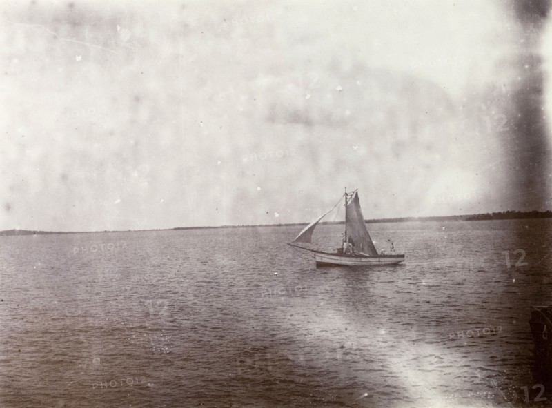 Mail boat on Lake Victoria. A small mail boat sails of the coast of Lake Victoria. Lake Victoria, British East Africa (Kenya), 1906., Nyanza, Kenya, Eastern Africa, Africa.