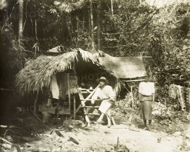 Bintang-Kendrong boundary camp. British surveyor and his Malay assistant at a survey camp on the boundary line between Gunung Bintang (1862 m.) in Kedah and Gunung Kenderong (1223 m.). Perak, British Malaya (Malaysia), circa 1902., Perak, Malaysia, South East Asia, Asia.