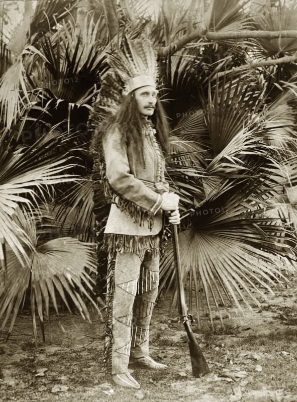 Mr Sitwell in fancy dress. S. A. H. Sitwell, a British employee of the Bank of Bengal, poses in fancy dress as a native American chief. Probably Kolkata, India, circa 1905. India, Southern Asia, Asia.