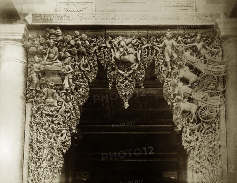 Wood carving at Shwe Dagon Pagoda. Detail of an elaborate wood carving at the main entrance to the Buddist temple of Shwe Dagon Pagoda. Rangoon (Yangon), Burma (Myanmar), circa 1885. Yangon, Yangon, Burma (Myanmar), South East Asia, Asia.