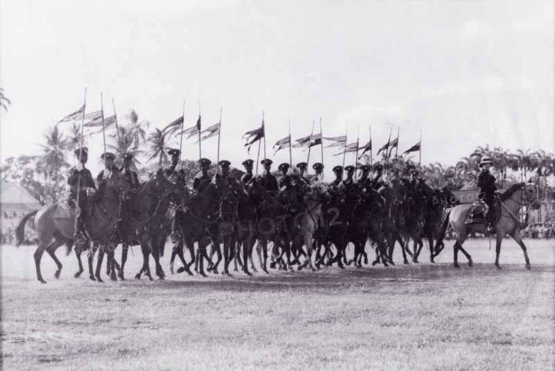 March past at the wall'. A troop of mounted police officers trot in line with flags at the Eve Leary parade ground on the occasion of King George VI's birthday. Georgetown, Guyana, 1948. Georgetown, Demerara-Mahaica, Guyana, South America, South America .