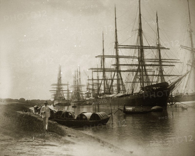 Vessels on the Hooghly River. A number of East Indiamen sailing ships are moored on the Hooghly River alongside several smaller sampans. Calcutta (Kolkata), India, circa 1887. Kolkata, West Bengal, India, Southern Asia, Asia.