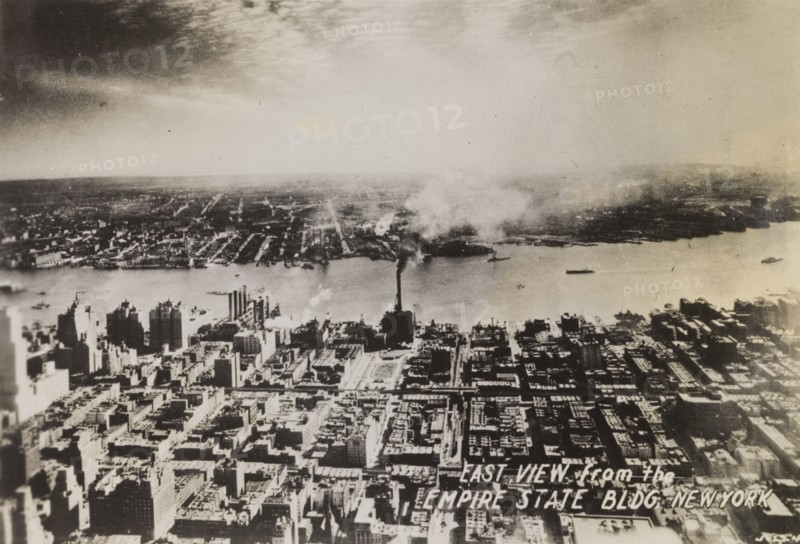 East view of Manhattan Island. View, facing east, of Manhattan Island, taken from the top of the Empire State Building. New York, United States of America, circa 1942. New York, New York, United States of America, North America, North America .