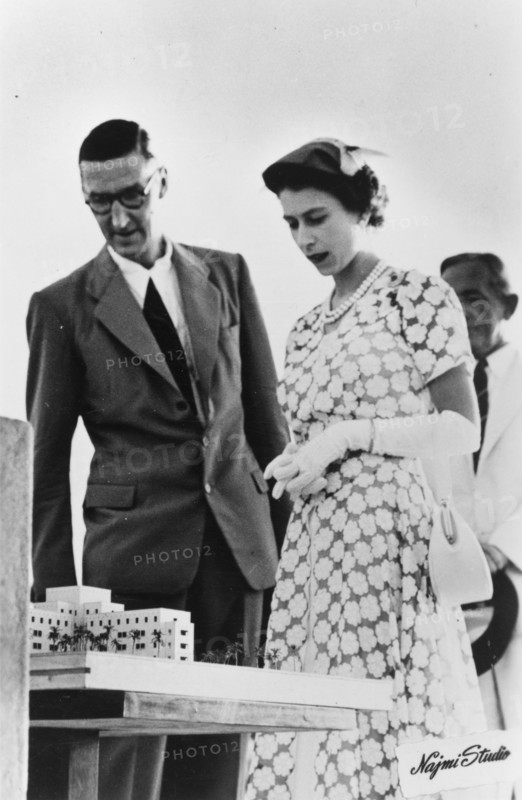 Queen Elizabeth II on royal tour of Aden, 1954. Queen Elizabeth II is shown an architect's model by an official, during her visit to Aden as part of a royal tour of the Commonwealth from November 1953 to May 1954. Aden, Yemen, 27 April 1954. Aden, Adan, Yemen, Middle East, Asia.