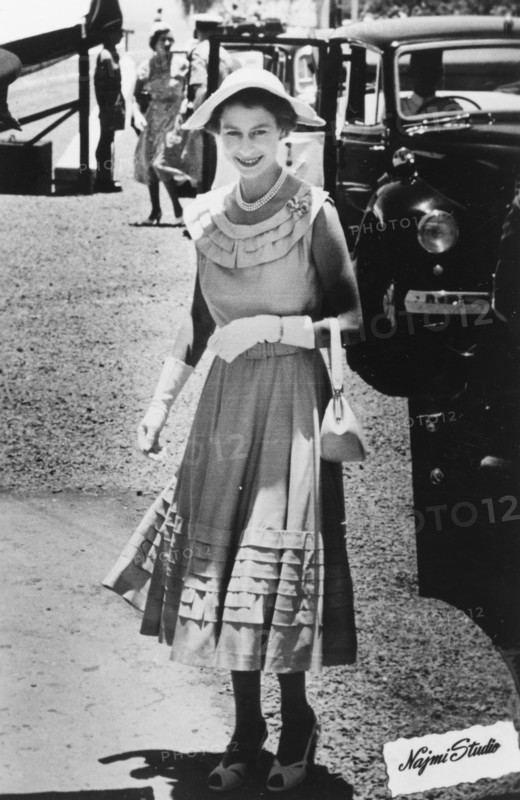 Queen Elizabeth II visiting Aden, 1954. Queen Elizabeth II smiles for the camera after arriving in a convoy of cars at a function in Aden, which she visited as part of a royal tour of the Commonwealth between November 1953 and May 1954. Aden, Yemen, 27 April 1954. Aden, Adan, Yemen, Middle East, Asia.