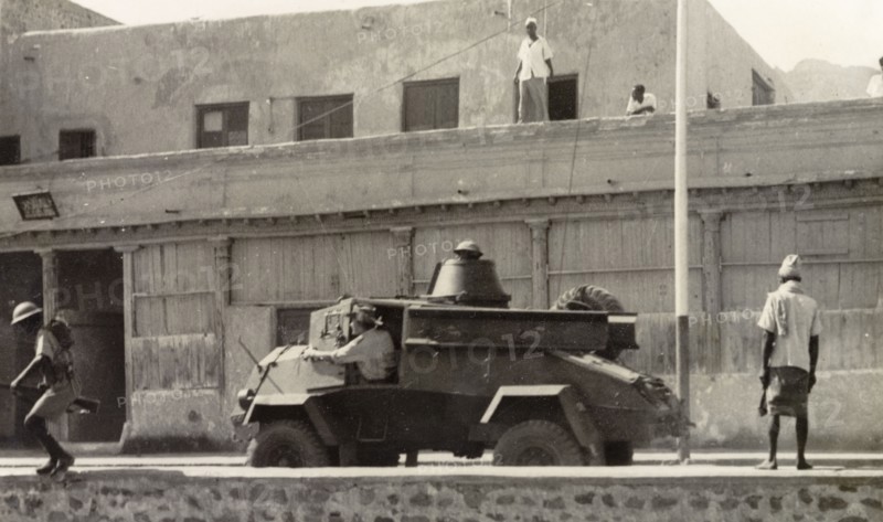 Armoured vehicle patrolling Aden during riots, 1947.. A light armoured vehicle is driven along a street in Aden, during the Arab riots that took place between 1-3 December 1947 in response to the United Nations Partition Plan for Palestine. Aden, Yemen, December 1947. Aden, Adan, Yemen, Middle East, Asia.