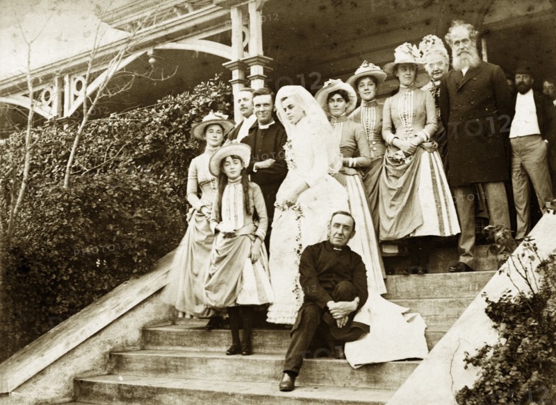 The Brodribb-Pughe wedding. Wedding photograph of Ellen May Brodribb and the Reverend Thomas St John Parry Pughe. The bride and groom stand on the steps of a large colonial house with family and guests. The father of the bride, Francis Brodribb, stands on the steps next to the female attendants. Toowoomba, Australia, 1888. Toowoomba, Queensland, Australia, Australia, Oceania.