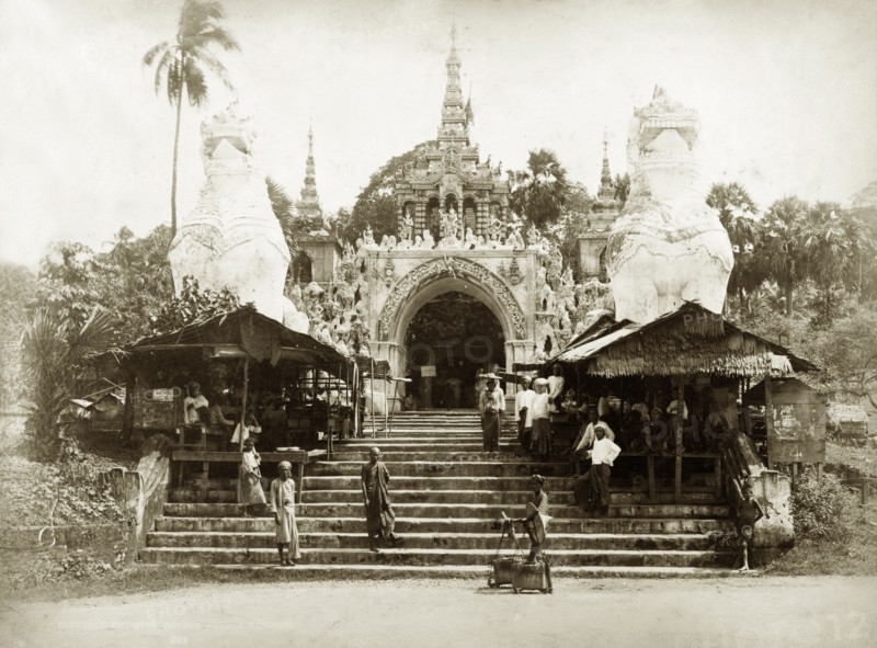 The Shwe Dagon Pagoda. Steps leading up to the main, southern entrance to the Buddist shrine of Shwe Dagon Pagoda, protected by two 'chenthe' (half-lion, half-dragon guardian figures). Rangoon (Yangon), Burma (Myanmar), circa 1885. Yangon, Yangon, Burma (Myanmar), South East Asia, Asia.