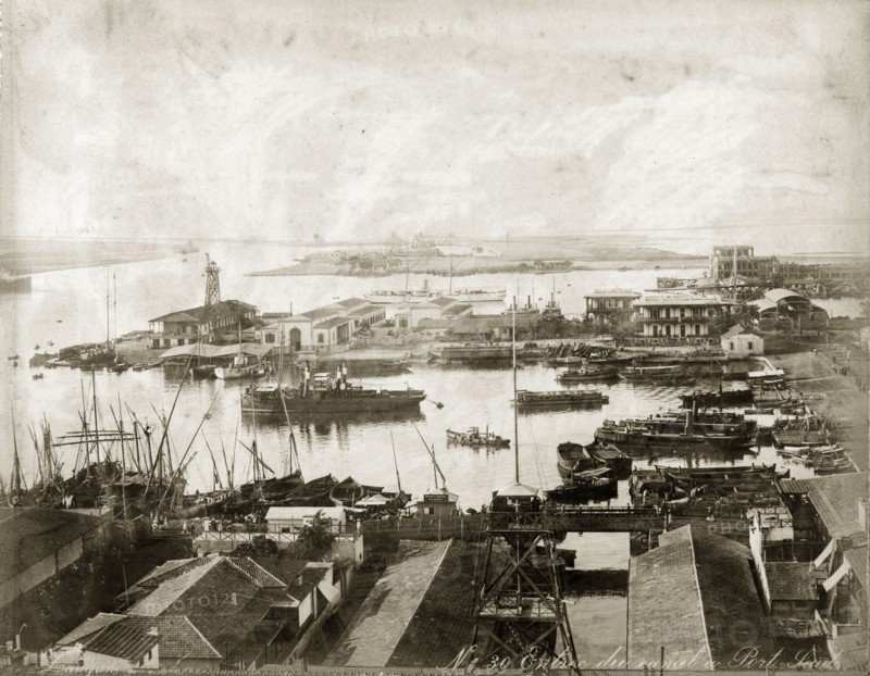 Entrance to the Suez Canal at Port Said. Vessels moored at a Port Said harbour at the entrance to the Suez Canal. Port Said, Egypt, circa 1885. Port Said, Port Said, Egypt, Northern Africa, Africa.