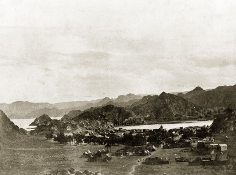 Valley outside Muscat. View across a valley outside Muscat, showing a village surrounded by mountains. Near Muscat, Oman, circa 1900., Muscat, Oman, Middle East, Asia.