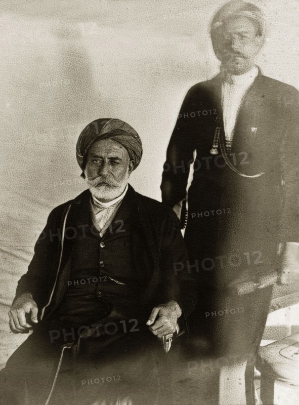 Officials of Lingah. Portrait of two officials from Qeshm Island dressed in Western-style suits. Lingah, Qeshm Island, Persia (Iran), circa 1900. Lingah, Qeshm Island, Iran, Middle East, Asia.