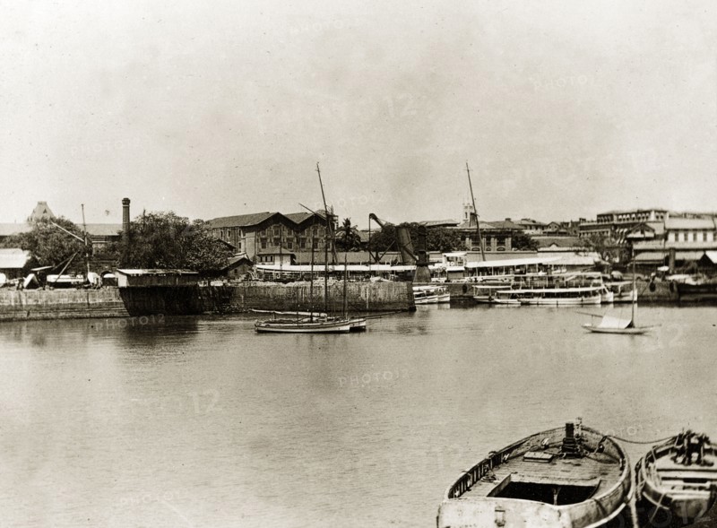 RIMS dockyard in Bombay. Boats moored in the harbour of a government dockyard belonging to the Royal Indian Marine Service. Bombay (Mumbai), India, circa 1900. Mumbai, Maharashtra, India, Southern Asia, Asia.